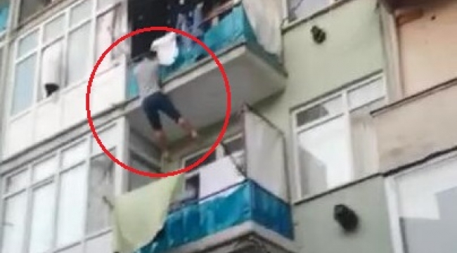 Yangında balkondan alt balkona atladı